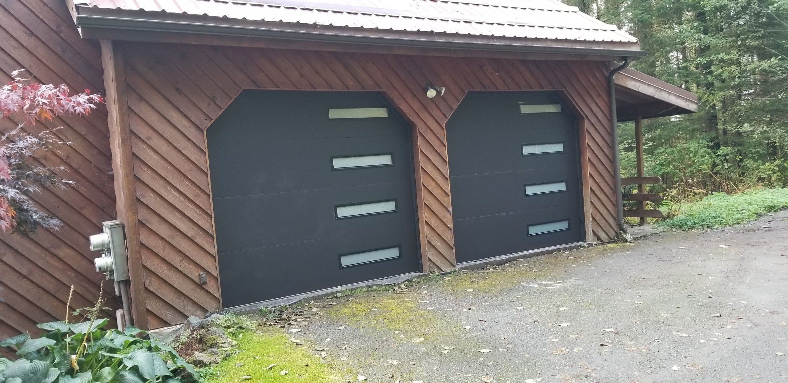 Project Stunning Wood Garage with Sleek Black Doors image